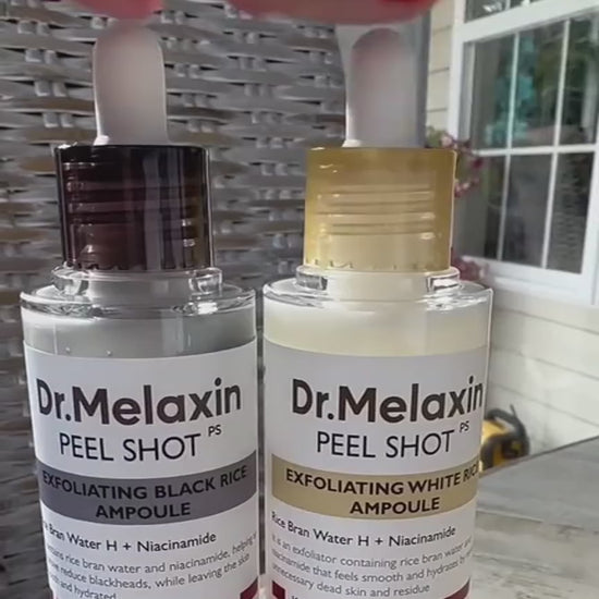Supplier-provided presentation of the two Dr. Melaxin Peel Shot ampoules: Black Rice and White Rice. Muted product set footage.